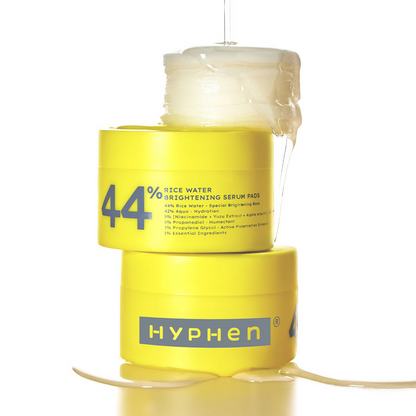 Yellow container of Hyphen 44% Rice Water Brightening Serum Pads on a white background